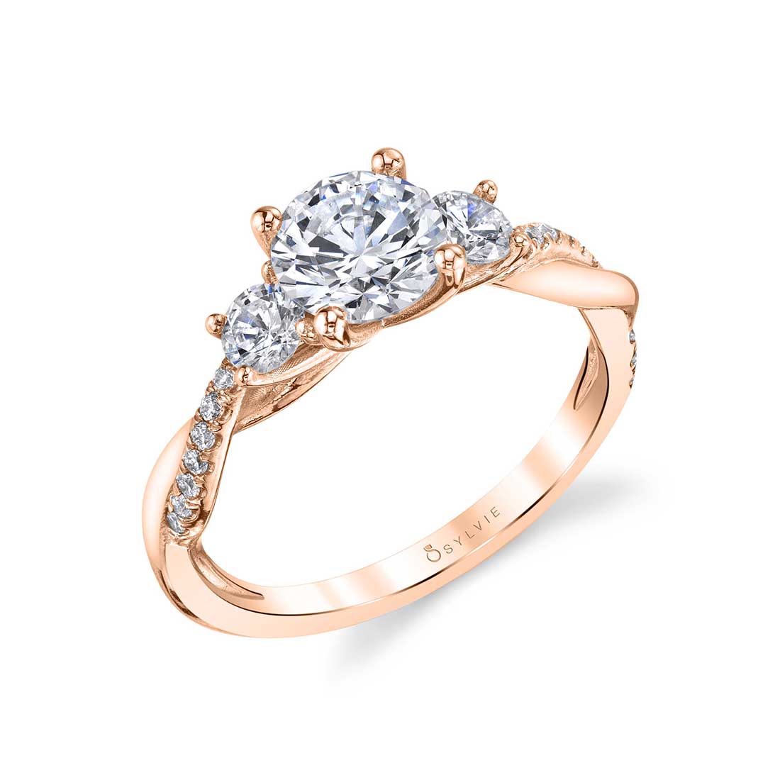 A rose gold three stone diamond engagement ring