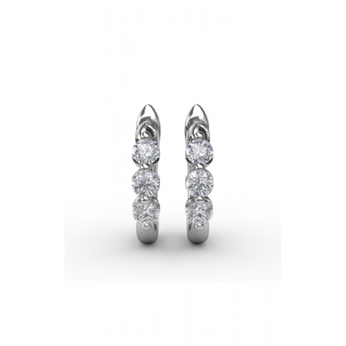 A white gold hoop earrings adorned with three round, diamonds vertically aligned, set against a white background.