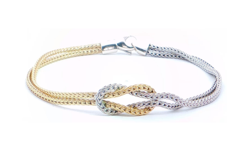 A two-tone gold bracelet from John Hardy, available at Drenon Jewelry.