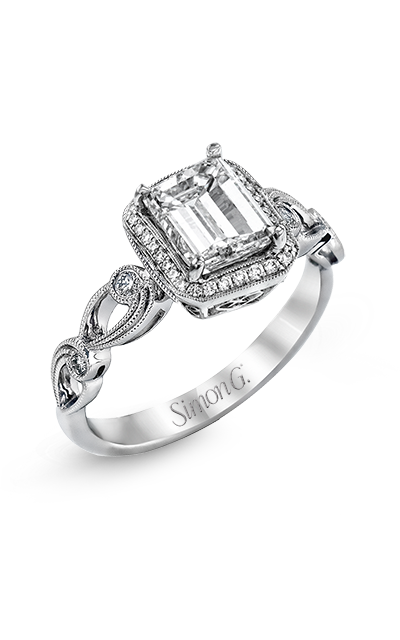 A white gold emerald-cut halo ring with milgrain leaf motifs band