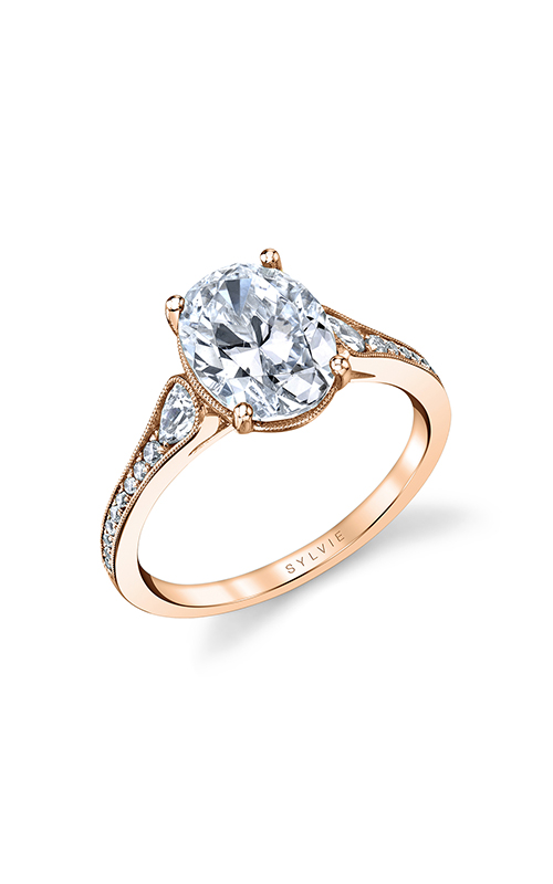 A rose gold sidestone oval-cut engagement ring