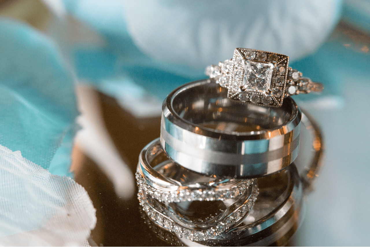 A close-up of a stunning stack of wedding bands and a dazzling engagement ring. A close-up of a stunning stack of wedding bands and a dazzling engagement ring.